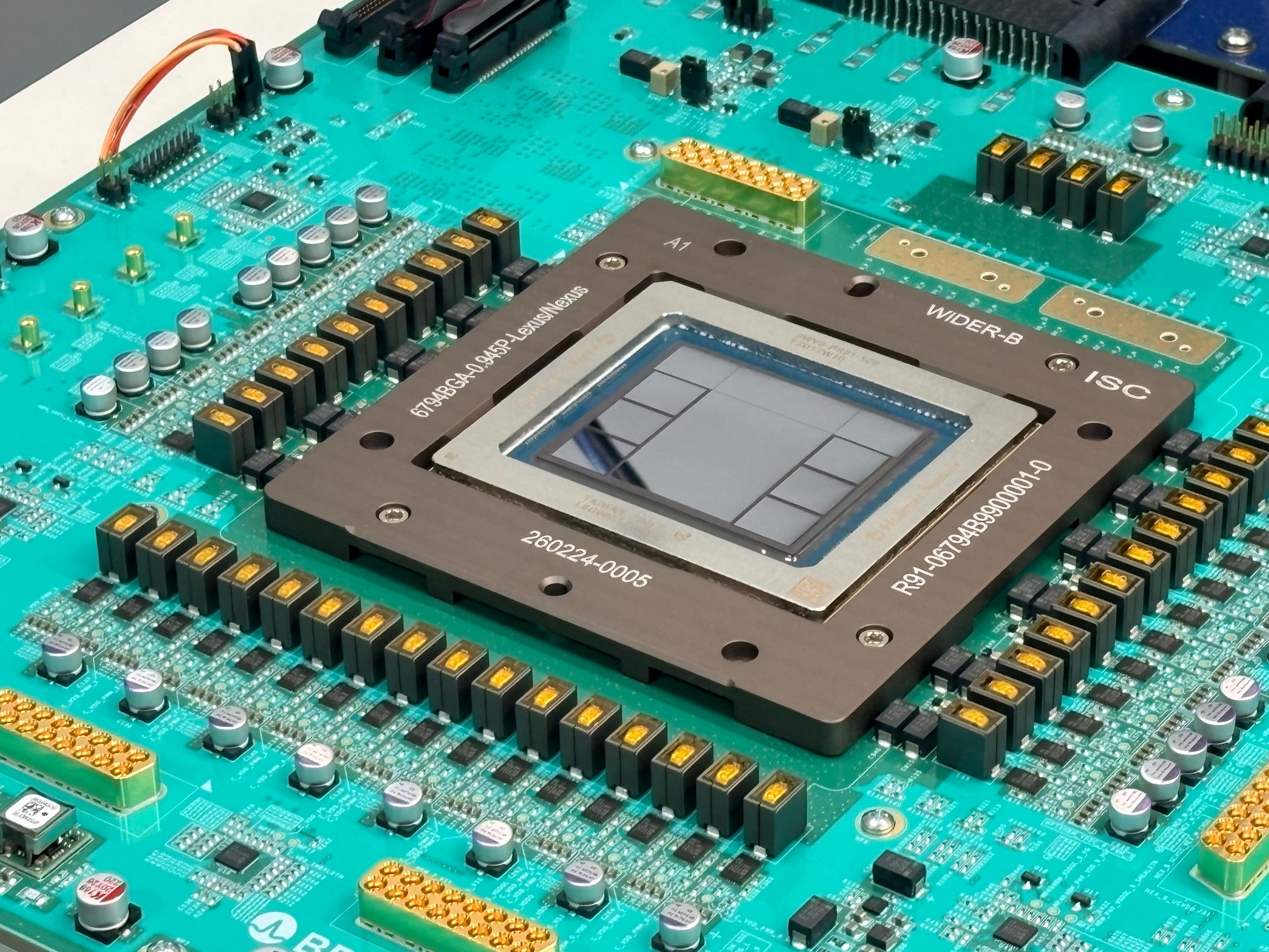 Close-up of the Jalapéño inference chip mounted on a teal circuit board, showing the chip package and surrounding components.